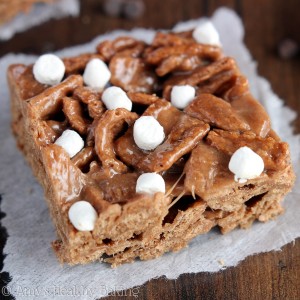 These hot chocolate cereal treats are a fun twist on classic Rice Krispie squares! They’re extra gooey and taste just like a mug of hot cocoa. Made with chocolate cereal and topped with itty bitty marshmallows, they’re absolutely adorable — and positively irresistible too!