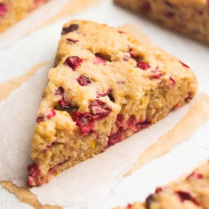 The BEST healthy cranberry orange scones recipe! This healthy baking recipe is perfect for healthy snacks and healthy breakfasts. Really soft inside and bursting with fruit flavor, these healthy orange cranberry scones are made with Greek yogurt, no sugar, and fresh cranberries or dried cranberries. They’re also an easy healthy recipe that’s clean eating with a gluten free option. Add this cranberry recipe to your list of fall snack ideas and healthy breakfast recipes to try!