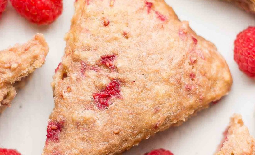 These healthy raspberry almond scones are simple to make! You just need 1 bowl. Greek yogurt makes these raspberry scones moist (no heavy cream!) & gives them a protein boost too. These healthy scones are low calorie, clean eating & made with no white sugar. Find this easy recipe for raspberry breakfast scones on amyshealthybaking.com.