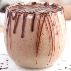 Looking for protein shake recipes? Try this healthy chocolate milkshake! Thick and creamy with the BEST flavor, this healthy smoothie recipe is high protein and easy to make without powder. Only 5 ingredients and no bananas either! You’ll love this drinking healthy chocolate protein milkshake for breakfast or as a post workout food. It’s clean eating, gluten free, and low calorie! The perfect protein smoothie idea! Save this chocolate protein shake recipe!