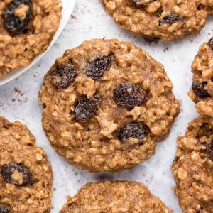 The BEST healthy banana oatmeal raisin cookies recipe! Soft, chewy, and full of sweet fruit flavor, these healthy oatmeal cookies are an easy healthy recipe that's low calorie and clean eating with a gluten free option. These banana oatmeal cookies are really quick to make too — with no refined sugar and no eggs! Save this healthy dessert recipe! You'll love these healthy cookies!