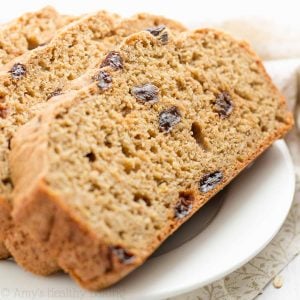 Looking for easy breakfast ideas? Try this healthy oatmeal raisin breakfast quick bread! This healthy breakfast recipe yields a really moist loaf filled with soft oats and sweet raisins. It’s also clean eating with a gluten free option! This healthy quick bread recipe is made with Greek yogurt and no yeast, baked in a loaf pan… And tastes like oatmeal raisin cookies! Everyone will love this breakfast bread! Save this healthy baking idea!