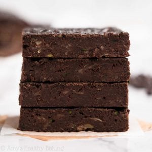 Healthy Zucchini Brownies -- SO rich & fudgy, but only 63 calories! They always cure my chocolate cravings! And they're really easy to make! ♡ easy healthy zucchini brownies. best zucchini brownies recipe. weight watchers chocolate zucchini brownies. fudgy zucchini brownies.