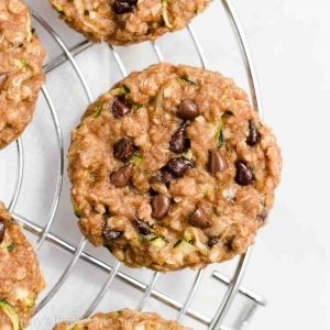 If you’re looking for easy breakfast ideas, you’ll love these healthy chocolate chip zucchini oatmeal breakfast cookies! Soft, chewy, and full of oats, these zucchini cookies are clean eating with a gluten free option. No bananas required for this healthy breakfast recipe! They’re naturally sweetened with an irresistible spice flavor. These healthy oatmeal cookies are great for kids — and adults love them too! They’re the BEST healthy breakfast cookies!
