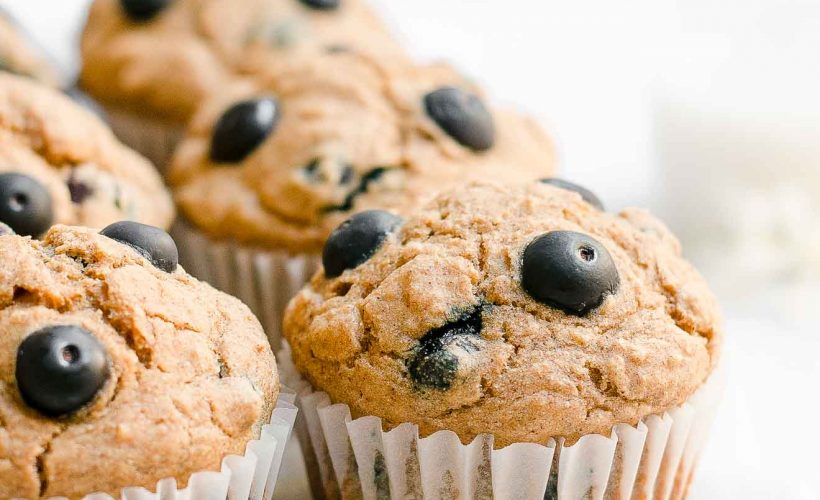 Looking for healthy breakfast recipes? These healthy blueberry oatmeal muffins are the BEST! Soft and moist with lots of sweet fruit throughout, these easy blueberry muffins are clean eating and low calorie with no sugar. Greek yogurt gives this healthy muffin recipe the best texture – and a protein boost! They’re a great healthy snack idea too. Gluten free option included!