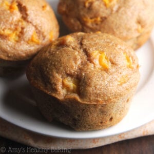 Healthy Small Batch Maple Peach Muffins – an easy clean eating recipe with the same flavors as peach pie! These healthy peach muffins are really moist & soft (like cupcakes!) and SIMPLE to make. Low calorie, no refined sugar & perfect for breakfast! Peach muffins healthy greek yogurt. Low calorie peach muffins. Peach muffins easy healthy. Peach muffins with fresh or canned peaches.
