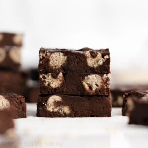 These chocolate chip cookie dough brownies are INCREDIBLE! Homemade fudge brownies filled with edible cookie dough… Yet still lightened up & low calorie! These healthy brownies are simple to make too. They finish baking in mere minutes! My new FAVORITE brownie recipe! (low calorie, clean eating & no refined sugar!) ♡ cookie dough brownies recipe easy. brownies with cookie dough inside. healthy brownies recipe homemade. healthy dessert recipe. best chocolate chip cookie dough brownies recipe.