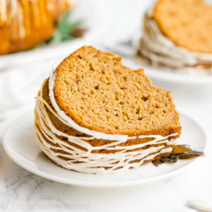 This pumpkin bundt cake recipe is the best fall treat! Full of sweet and cozy pumpkin spice flavor, this healthy pumpkin cake is super moist and easy to make. You’d never guess it’s low calorie and sugar free! This healthy dessert recipe is a fantastic Thanksgiving dessert idea too. Add this simple pumpkin recipe to your list of healthy baking ideas – it’s the BEST!