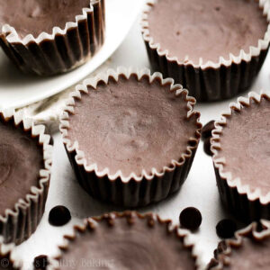 This mini chocolate fudge brownie bites recipe is an amazing healthy dessert! They’re an easy chocolate dessert that’s completely gluten free, dairy free, clean eating, and low calorie — yet they literally taste like fudge! These flourless brownies are a mini dessert that’s really quick to make and a great low calorie baking treat. Truly the best black bean brownies recipe! Add these healthy chocolate chunk flourless brownie bites to your healthy baking ideas list!