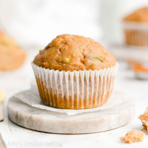Looking for healthy breakfast ideas? Try these healthy carrot zucchini muffins! Really moist with warm spices, they basically taste like carrot cake for breakfast! This healthy baking recipe is low calorie, clean eating, and easy to whip up. Made with greek yogurt and no sugar, these zucchini carrot muffins are a healthy breakfast recipe everyone will love! Gluten free option included for these healthy muffins too!