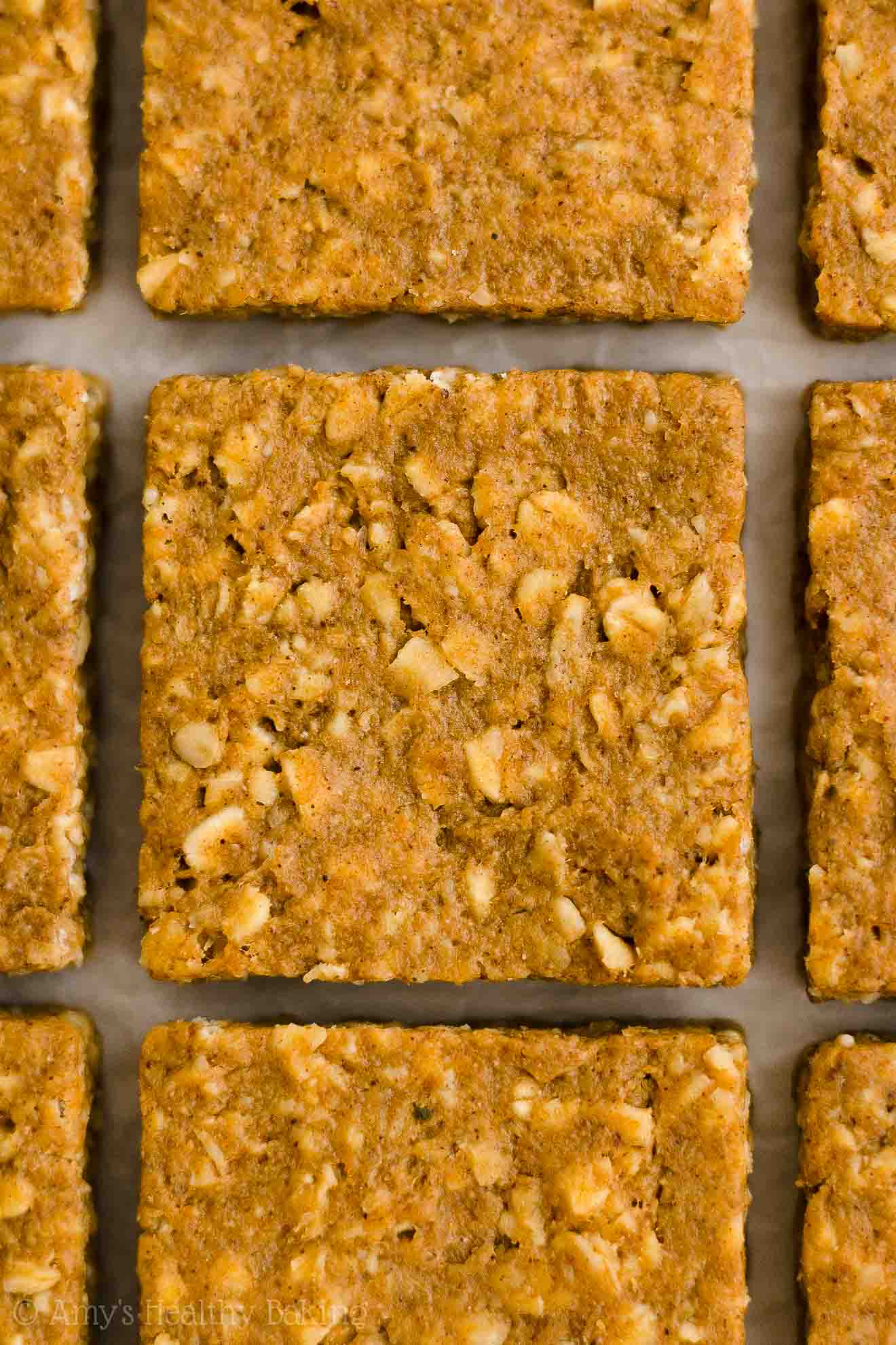 close-up overhead of freshly sliced healthy pumpkin oatmeal bars – easy oat bars recipe for breakfasts and snacks – vegan, gluten free, egg free, dairy free, and clean eating with whole wheat and gluten free options – made with oats, pumpkin, spices, and no refined sugar