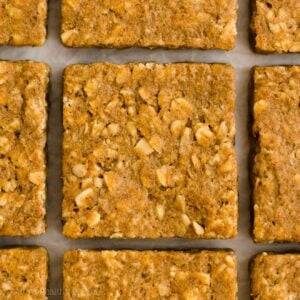 These healthy pumpkin oatmeal bars are perfect for fall! Filled with warm spices and oats — but no eggs and no sugar — these pumpkin bars are really soft and chewy with flavors just like pumpkin pie. These healthy oatmeal bars are also clean eating and vegan with gluten free options! Add this easy pumpkin recipe for baked pumpkin oat bars to your lists of healthy snacks and healthy breakfast ideas to try. It’s the BEST healthy pumpkin bars recipe!