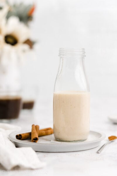 The BEST sugar free gingerbread creamer recipe! This easy homemade coffee creamer adds a taste of gingerbread cookies to your coffee! Made with cozy spices & dairy free milk, this healthy coffee creamer recipe is vegan & clean eating. This DIY coffee creamer also makes your coffee taste like Starbucks holiday drinks! The perfect addition to any Christmas holiday drinks recipe. Save this pin for how to make gingerbread coffee creamer without condensed milk!