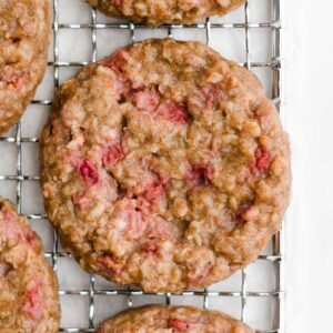 Looking for healthy snacks recipes or healthy breakfast ideas? Make these healthy strawberry oatmeal breakfast cookies! Soft, chewy & full of oats, these strawberry cookies are clean eating with a gluten free option. These healthy oatmeal cookies are easy too! Great healthy snacks for kids & healthy breakfast meal prep. These healthy sweet treats are our favorite yummy breakfast cookies. They’re the BEST oatmeal cookies! Add them to your list of healthy snacks to make!